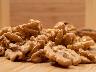 Walnut on a wooden background. Raw walnut.
