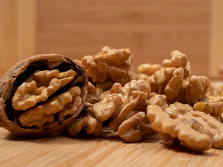 Walnut on a wooden background. Raw walnut.