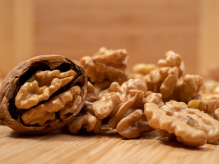 Walnut on a wooden background. Raw walnut.
