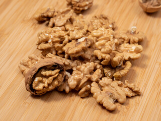 Walnut on a wooden background. Raw walnut.