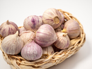 Heads of garlic on a white background.