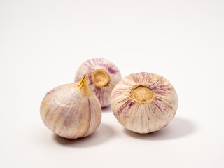Heads of garlic on a white background.