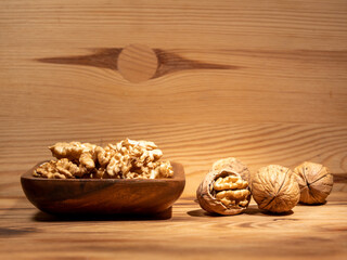 Walnut on a wooden background. Raw walnut.