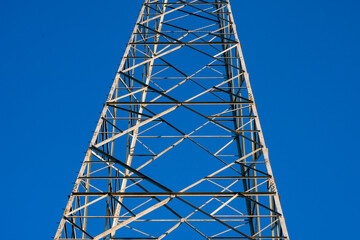 electric light pylon, steel structure for the infrastructure for the transport of electric cables with a grid of services and plants. symbol for industry and development.