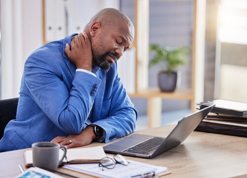 Black man , stress and tired burnout with neck pain in the office due to bad posture and uncomfortable chair. Fatigue, problem or frustrated worker annoyed with body injury or muscle backache at work