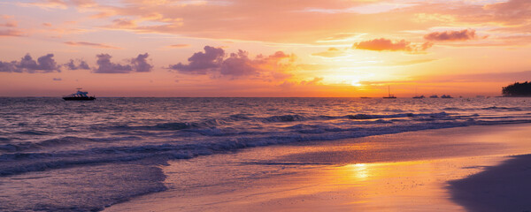 Fototapeta na wymiar Panoramic coastal landscape with raising sun