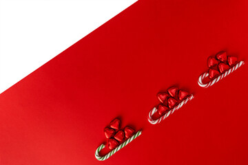 Christmas background with a sled, candy and a caramel cane