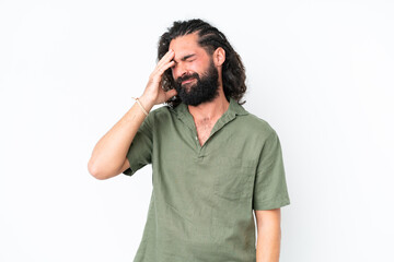Young man with beard over isolated white background laughing