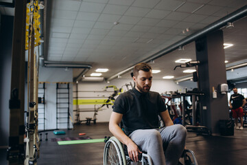 Person who uses a wheelchair training in the gym. Rehabilitation center
