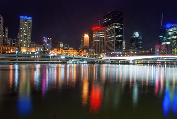 Naklejka na ściany i meble Brisbane night city view with skyscrapers reflections on city river - Australia