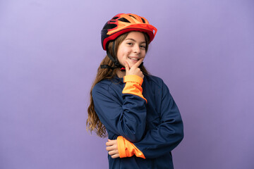Little caucasian girl isolated on purple background happy and smiling