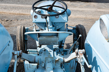 Rear view of an old antique tractor for sale at the equipment auction in Fayetteville Tennessee.