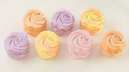 Marshmallows for the present. Traditional colored desserts for the holiday. Top view.