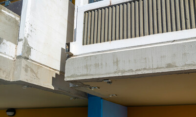 Balconies of condominium facade repaired after degradation and cracks in the reinforced concrete...
