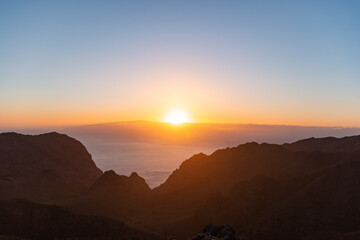 View from a viewpoint of the mountains of Tenerife at sunset overlooking La Gomera
