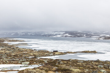 Frozen lake in the Hardangervidda mountain area in Norway