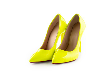 a pair of yellow women's high-heeled shoes on white background