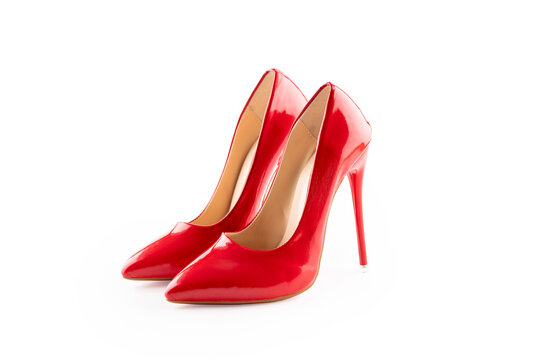 a pair of red women's high-heeled shoes on white background