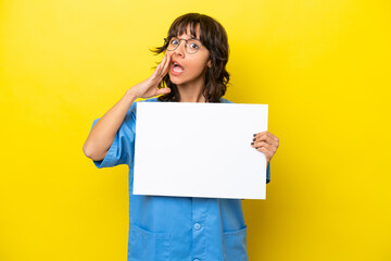 Fototapeta na wymiar Young nurse doctor woman isolated on yellow background holding an empty placard and shouting