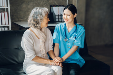 Asian doctor women and patient discussing while sitting. Medicine and health care concept.