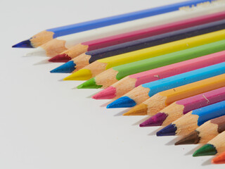 Colored pencils isolated on a white background. Close it.