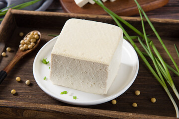 Block of fresh Tofu on wooden background