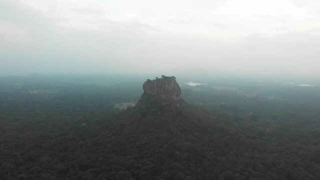 Aerial view of Sigiriya Lion's Rock, a rock fortress located in the northern Matale District, Dambulla, Sri Lanka. Drone footage 4K