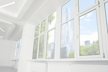 Fototapeta na wymiar Empty office room with clean windows and lighting. Interior design