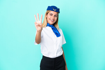 Airplane stewardess Uruguayan woman isolated on blue background happy and counting three with fingers