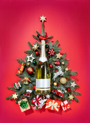 Christmas fir-tree branches with decoration toys and champagne. Merry Christmas and Happy New Year concept