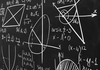 Different mathematical formulas written with chalk on blackboard