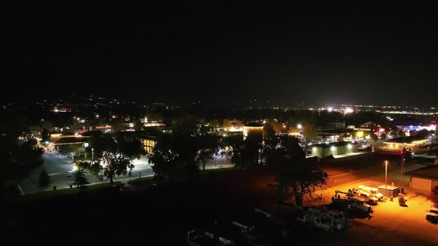 Tehachapi City, California at night - ascending aerial view