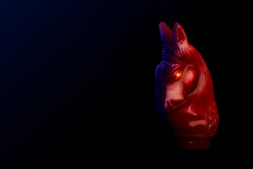 Red chess war horse in black background. Business strategy concept.