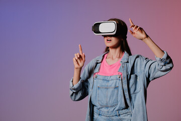 VR virtual reality glasses on a girl. Looks to the future. Touching the new. Fantastic virtual...