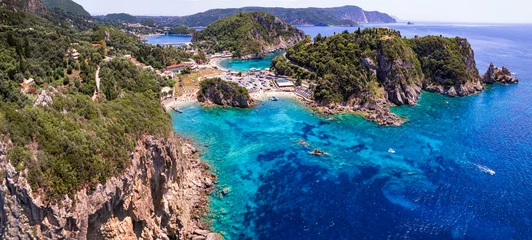Poster Corfu island. aerial drone view of  most popular and beautiful Paleokastrtsa tourist village and resort, Ampelaki Beach. Greece, ionian islands © Freesurf