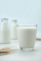 Glass of milk on blue background ,Concept of farm dairy products with copy space.