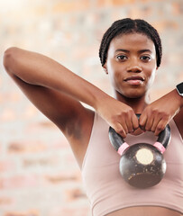 Kettlebell, black woman portrait and fitness in a wellness, training and health gym for sport. Sports workout, exercise and strong arm muscle for healthy body of a athlete with motivation and focus