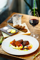 Deer tenderloin. Truffle-potato puree, porcini mushrooms, baked leek and carrot, juniper bread, port wine sauce. Delicious healthy traditional food served for lunch in modern gourmet restaurant