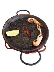 Spanish black squid ink paella with lobsters and scallops isolated. Classical Spanish cuisine