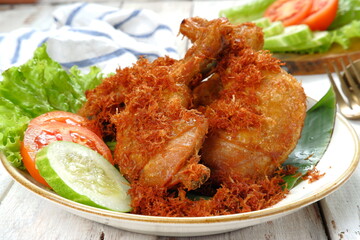 Ayam Goreng serundeng, fried chicken sprinkled with  grated coconut with curry spices or serundeng 