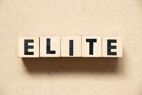 Alphabet letter block in word elite on wood background