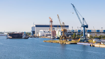 The shipyards MV Werften and Neptun Werft in the harbour of Rostock in Germany - obrazy, fototapety, plakaty
