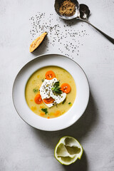 photography of a bowl of soup with a spoon in it - AI Generated