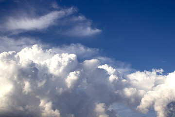 Naklejka na ściany i meble white clouds with sunlight on blue sky background
