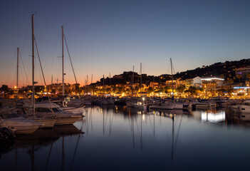 Port of Le Lavandou in the evening, France. Luxury yachts and motor boats.