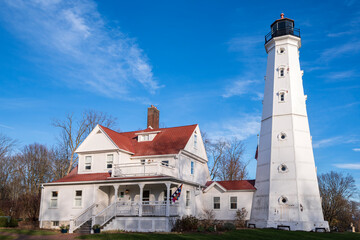 landmark north point lighthouse and Queen Anne style lightkeeper quarters off lake michigan lakefront in milwaukee