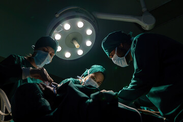 A team of professional doctors perform surgery in a hospital, a group of surgeons working in the...