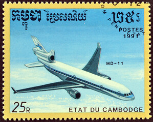Cancelled postage stamp printed by Cambodia, that shows Airplane McDonnell Douglas MD-11, circa...