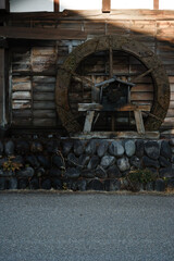Fototapeta na wymiar Japanese waterwheel SUISYA sets mill barn KOYA in Minakami, Gunma | 水車と小屋・たくみの里