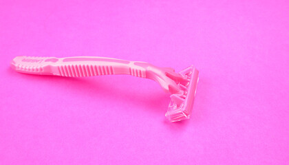 New pink disposable razors for safe shaving of female skin.Razor for smooth shaving. Sharp razors for personal hygienic routine. selective focus.